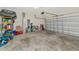 Attached garage with storage shelving and room for two cars at 17633 Cantarina Cv, Bradenton, FL 34211