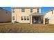 Two-story house with screened patio and grassy backyard at 17633 Cantarina Cv, Bradenton, FL 34211