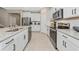 Modern kitchen with stainless steel appliances and granite countertops at 17633 Cantarina Cv, Bradenton, FL 34211