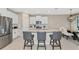Modern kitchen with island, stainless steel appliances, and granite counters at 17633 Cantarina Cv, Bradenton, FL 34211