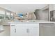 Kitchen island with granite countertop and stainless steel sink at 17633 Cantarina Cv, Bradenton, FL 34211