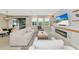 Living room featuring a modern fireplace and comfortable seating at 17633 Cantarina Cv, Bradenton, FL 34211