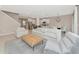 Open living space with light colored sofas and a coffee table at 17633 Cantarina Cv, Bradenton, FL 34211