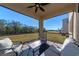 Relaxing screened patio offering scenic backyard views at 17633 Cantarina Cv, Bradenton, FL 34211