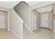 Modern staircase with carpeted steps and neutral wall colors at 17633 Cantarina Cv, Bradenton, FL 34211
