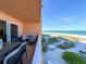 Spacious balcony with outdoor dining and ocean views at 1906 Gulf N Dr # 106, Bradenton Beach, FL 34217