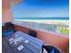 Balcony with ocean view and outdoor dining furniture at 1906 Gulf N Dr # 106, Bradenton Beach, FL 34217