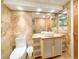 Clean bathroom with light wood vanity and vessel sink at 1906 Gulf N Dr # 106, Bradenton Beach, FL 34217