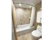Clean bathroom with a bathtub, shower, and updated fixtures at 1906 Gulf N Dr # 106, Bradenton Beach, FL 34217