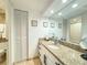 Bathroom features granite countertop and a large vanity at 1906 Gulf N Dr # 106, Bradenton Beach, FL 34217