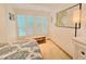 Bright bedroom with window seat and ocean-themed decor at 1906 Gulf N Dr # 106, Bradenton Beach, FL 34217
