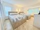 Guest bedroom with two twin-size beds and light decor at 1906 Gulf N Dr # 106, Bradenton Beach, FL 34217