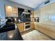Modern kitchen with stainless steel appliances and granite countertops at 1906 Gulf N Dr # 106, Bradenton Beach, FL 34217
