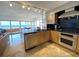 Modern kitchen with stainless steel appliances and granite counters at 1906 Gulf N Dr # 106, Bradenton Beach, FL 34217