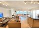 Open floorplan combining living, kitchen and dining areas at 1906 Gulf N Dr # 106, Bradenton Beach, FL 34217