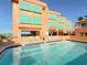 Inviting community pool with ample lounge chairs at 1906 Gulf N Dr # 106, Bradenton Beach, FL 34217