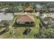 Aerial view of home's backyard, showcasing patio and landscape at 1985 White Feather Ln, Nokomis, FL 34275