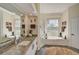Spa-like bathroom with granite vanity, large soaking tub, and walk-in shower at 1985 White Feather Ln, Nokomis, FL 34275