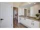 Elegant bathroom with granite countertops and modern cabinetry at 1985 White Feather Ln, Nokomis, FL 34275