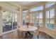 Breakfast nook with view of backyard patio and lush landscaping at 1985 White Feather Ln, Nokomis, FL 34275
