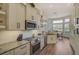 Modern kitchen with stainless steel appliances and ample counter space at 1985 White Feather Ln, Nokomis, FL 34275
