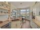 Spacious kitchen featuring granite countertops, modern cabinetry, and a breakfast nook at 1985 White Feather Ln, Nokomis, FL 34275