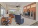 Relaxing living room with a comfortable sectional sofa and large windows at 1985 White Feather Ln, Nokomis, FL 34275