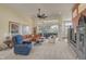 Bright living room showcasing a sectional sofa and access to outdoor patio at 1985 White Feather Ln, Nokomis, FL 34275