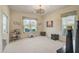 Bright and airy home office featuring large windows and hardwood floors at 1985 White Feather Ln, Nokomis, FL 34275