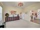 Home office with built-in shelving and plenty of natural light at 1985 White Feather Ln, Nokomis, FL 34275