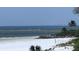 Stunning beach view with white sand and ocean at 20 Whispering Sands Dr # 306, Sarasota, FL 34242