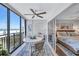 Coastal-themed bedroom with ocean view, king bed, and private balcony access at 20 Whispering Sands Dr # 306, Sarasota, FL 34242