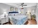 Spacious bedroom with coastal decor and comfortable king-size bed at 20 Whispering Sands Dr # 306, Sarasota, FL 34242