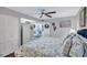 Bright bedroom with a king bed, built-in wardrobe, and coastal accents at 20 Whispering Sands Dr # 306, Sarasota, FL 34242