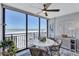Condo dining area with ocean view, round table, and wicker chairs at 20 Whispering Sands Dr # 306, Sarasota, FL 34242