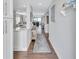 Bright entryway with hardwood floors and view to living room at 20 Whispering Sands Dr # 306, Sarasota, FL 34242