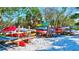 Colorful kayaks and paddleboards neatly stored on a rack at 20 Whispering Sands Dr # 306, Sarasota, FL 34242