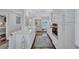 Modern white kitchen with stainless steel appliances at 20 Whispering Sands Dr # 306, Sarasota, FL 34242