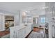 Modern white kitchen with island and breakfast bar at 20 Whispering Sands Dr # 306, Sarasota, FL 34242