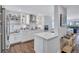 Modern white kitchen with stainless steel appliances at 20 Whispering Sands Dr # 306, Sarasota, FL 34242