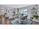 Modern kitchen with white cabinetry and an island breakfast bar at 20 Whispering Sands Dr # 306, Sarasota, FL 34242