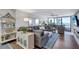 Relaxing living room with ocean views and comfortable sectional sofa at 20 Whispering Sands Dr # 306, Sarasota, FL 34242