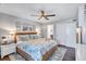 King-size bed in a serene main bedroom with ocean view and private balcony at 20 Whispering Sands Dr # 306, Sarasota, FL 34242
