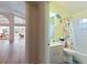 Small bathroom with shower/tub combo and beachy decor at 204 Venice Palms Blvd, Venice, FL 34292