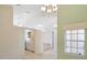 Dining area with view into kitchen and access to sunroom at 204 Venice Palms Blvd, Venice, FL 34292