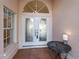 Entryway with double doors and a small table at 204 Venice Palms Blvd, Venice, FL 34292