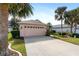 Exterior view of house with two-car garage at 204 Venice Palms Blvd, Venice, FL 34292