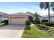 House exterior with driveway and landscaping at 204 Venice Palms Blvd, Venice, FL 34292