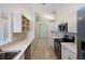 Kitchen with stainless steel appliances and white cabinets at 204 Venice Palms Blvd, Venice, FL 34292