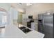 Kitchen boasts stainless steel appliances and a breakfast bar at 204 Venice Palms Blvd, Venice, FL 34292